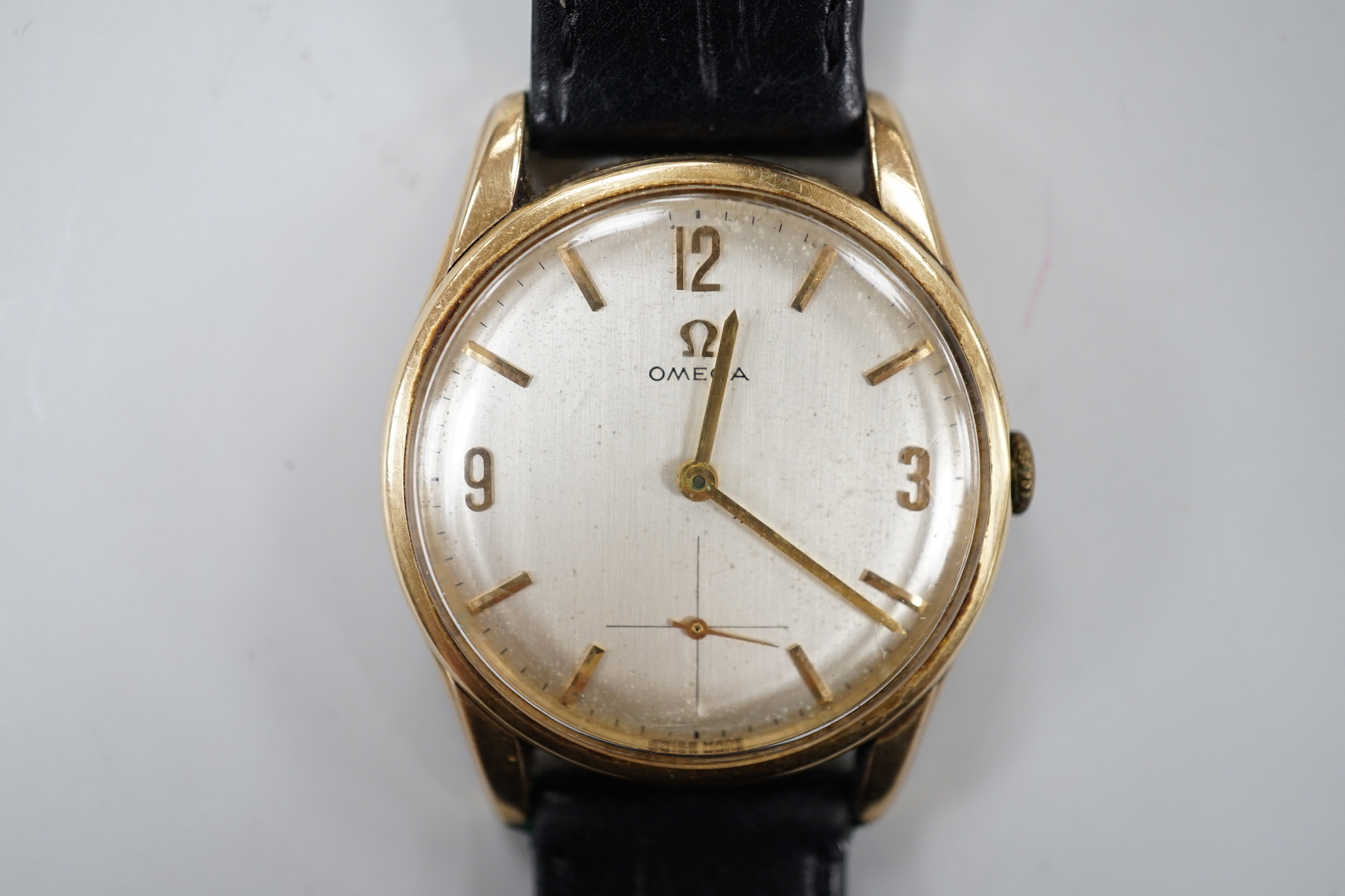 A gentleman's 1960's 9ct gold Omega manual wind wrist watch, with engraved inscription and associated strap, case diameter 34mm, movement c.269.